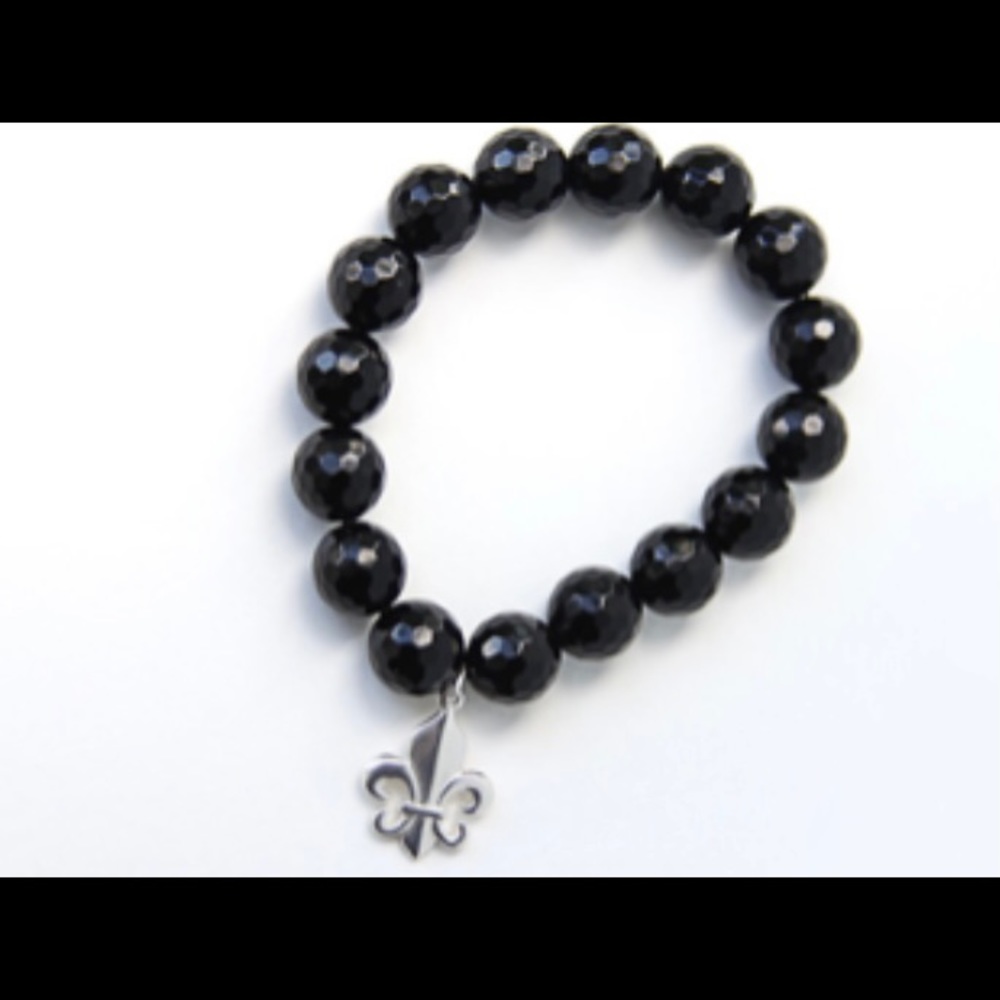 Handcrafted stretch bracelet with faceted black onyx beads and silver charm